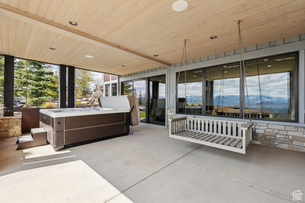 View of patio featuring a hot tub