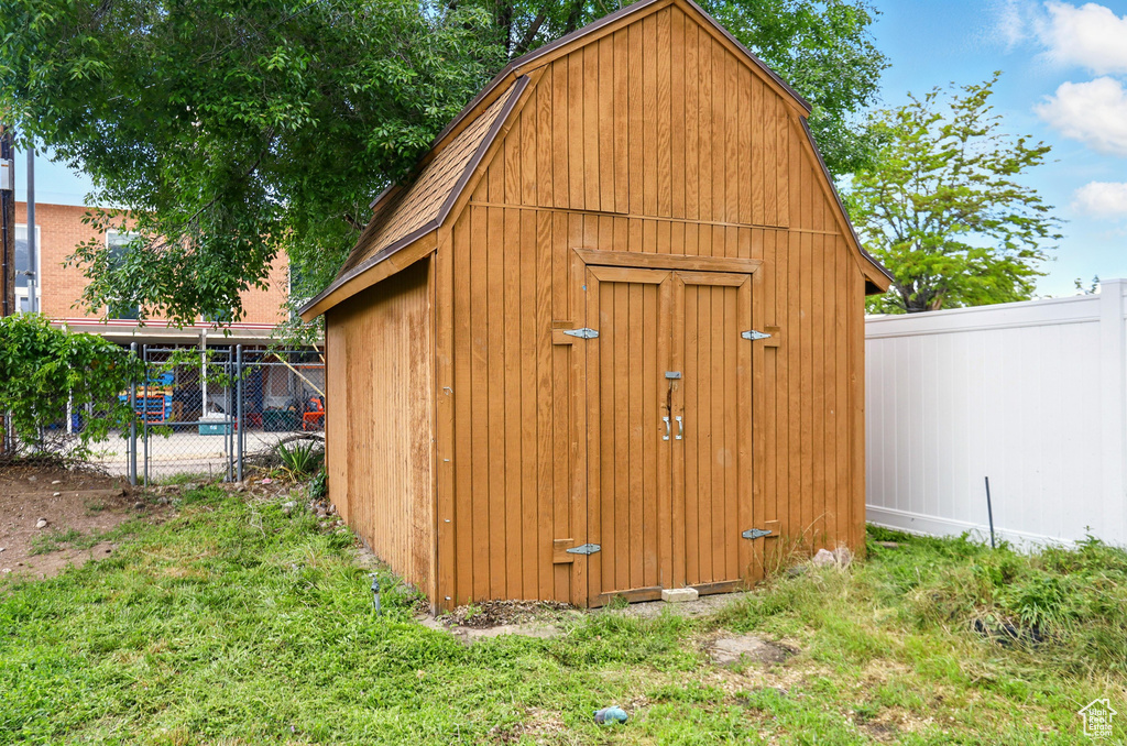 View of shed featuring a fenced backyard