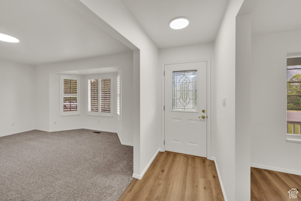 Foyer entrance featuring baseboards and light wood-type flooring