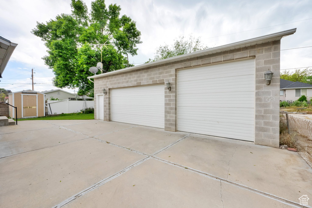 Detached garage with a storage shed