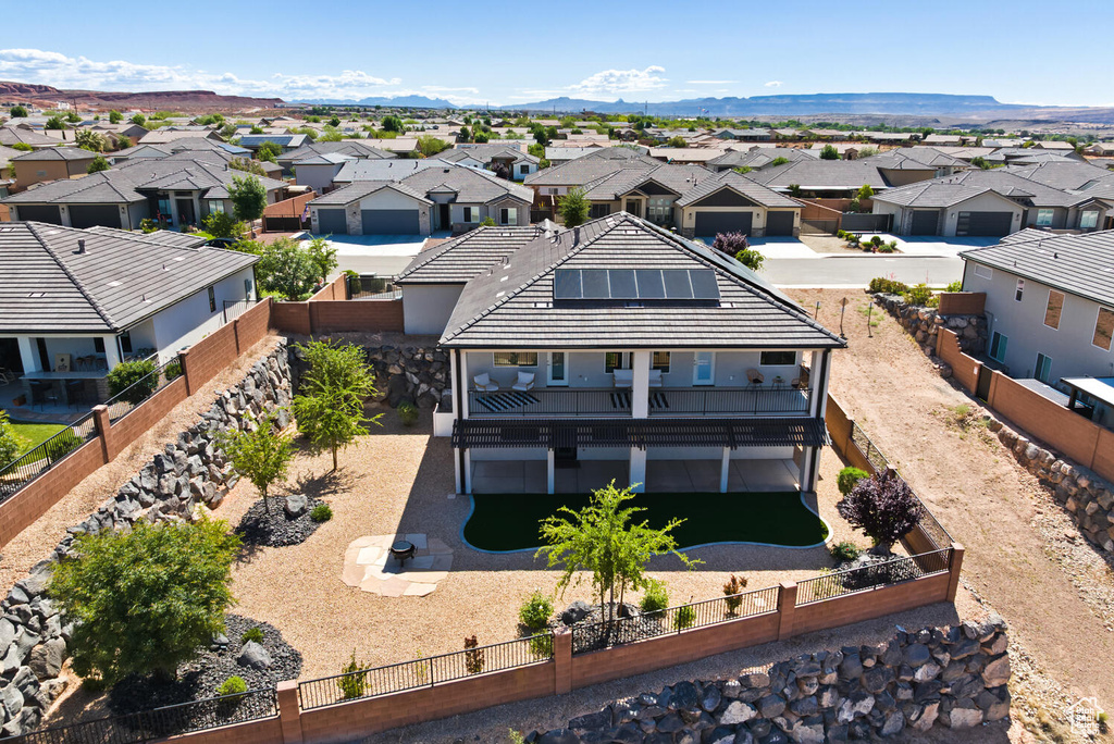 Aerial perspective of suburban area featuring a mountainous background