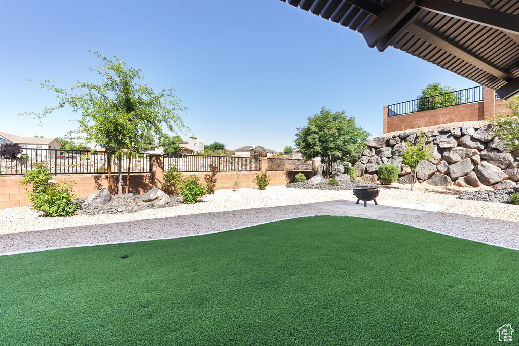 Fenced backyard with a patio