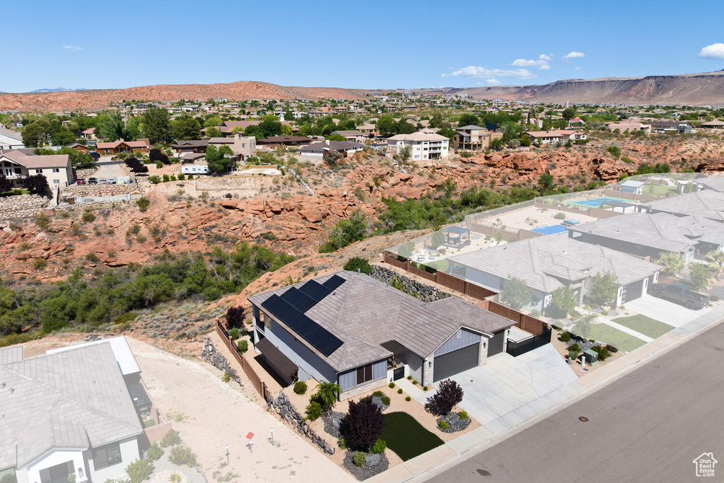 Aerial view of residential area featuring a mountain backdrop