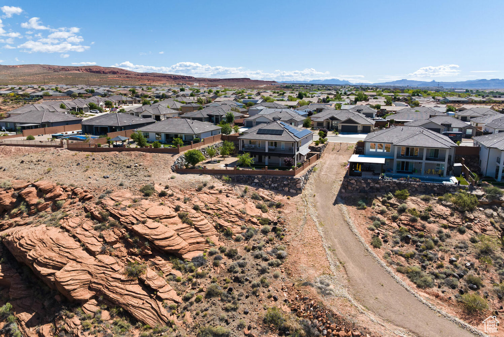 Aerial perspective of suburban area featuring a mountain backdrop