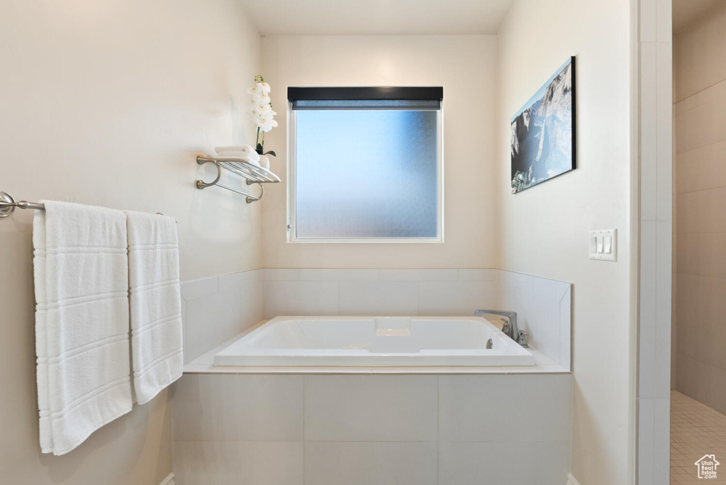 Full bath featuring a bath