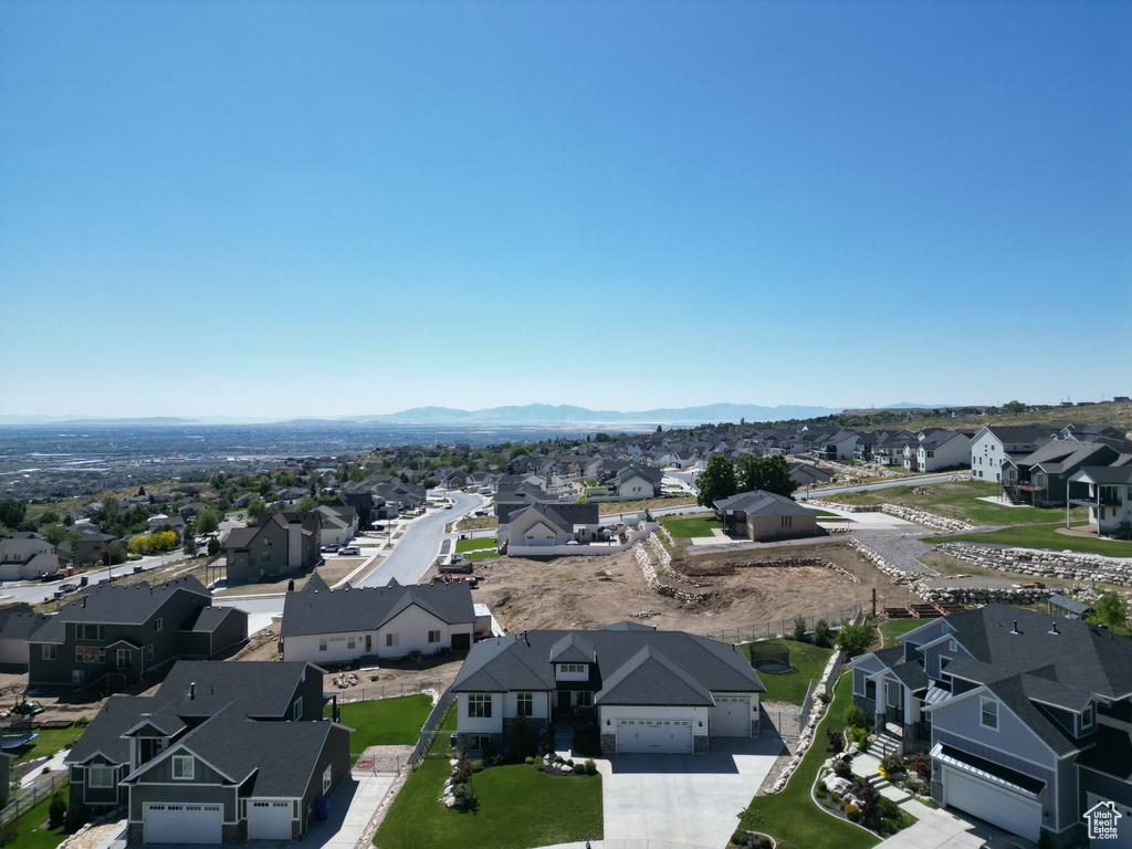 Aerial view of residential area featuring a mountain backdrop