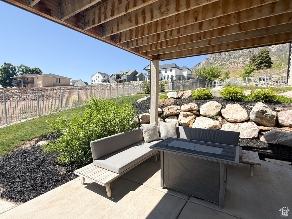 Fenced backyard with a patio area, a residential view, and outdoor lounge area