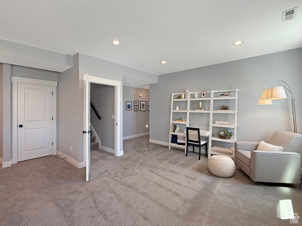 Sitting room with carpet flooring, stairway, recessed lighting, and baseboards