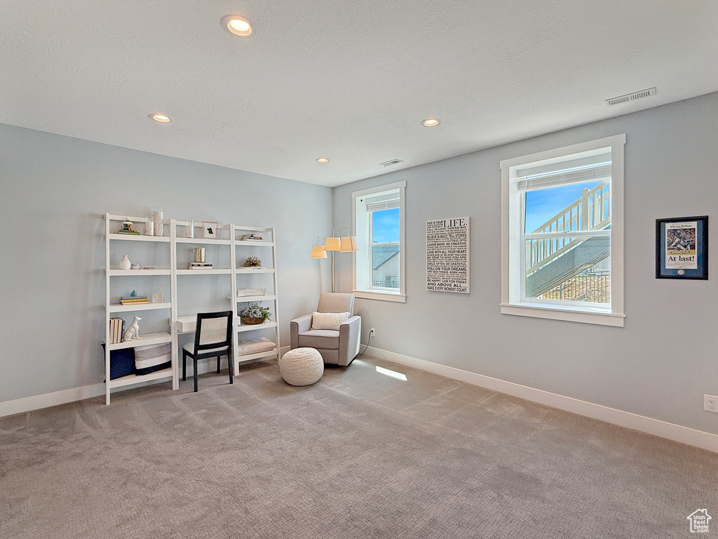 Sitting room with plenty of natural light, carpet floors, recessed lighting, and baseboards