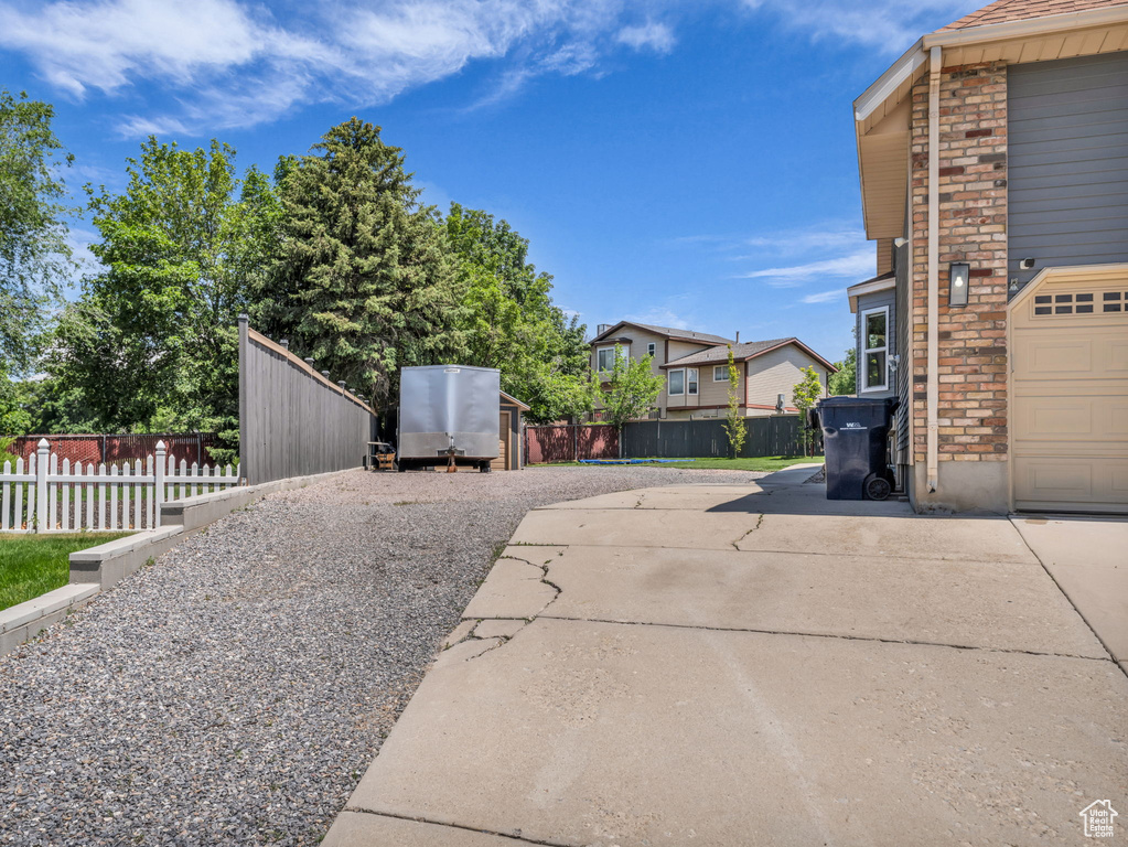 View of patio / terrace with concrete driveway and a residential view