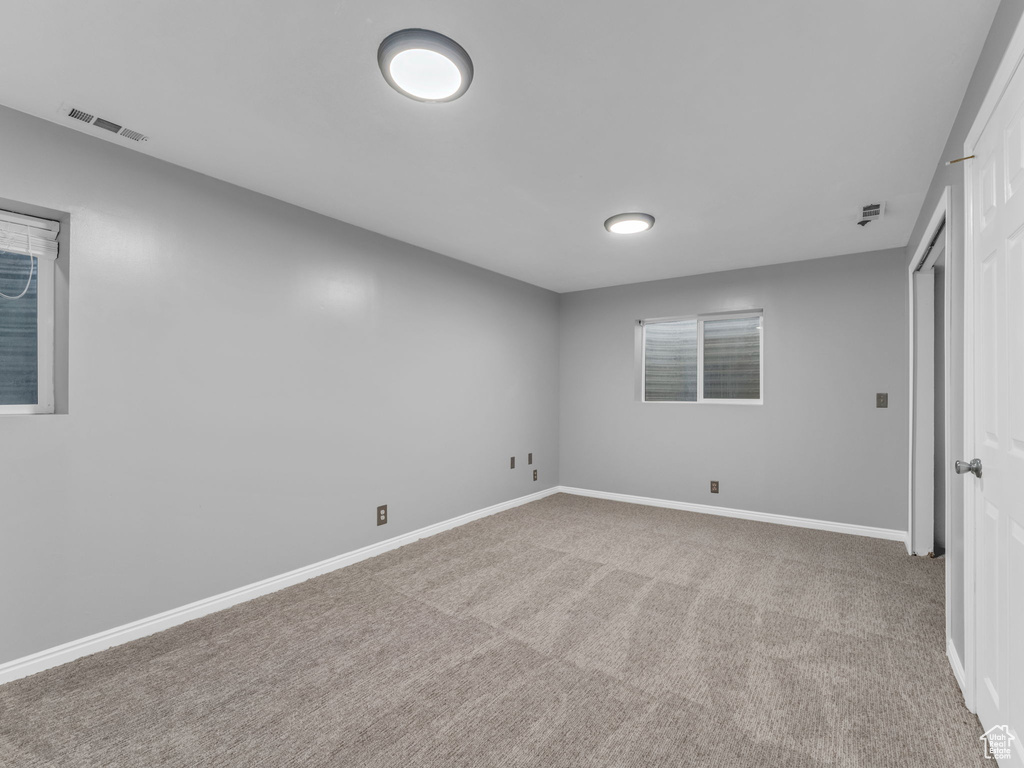 Unfurnished bedroom featuring carpet floors and baseboards