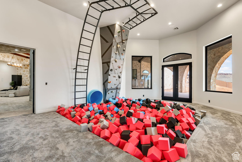 Miscellaneous room featuring carpet, healthy amount of natural light, french doors, recessed lighting, and baseboards
