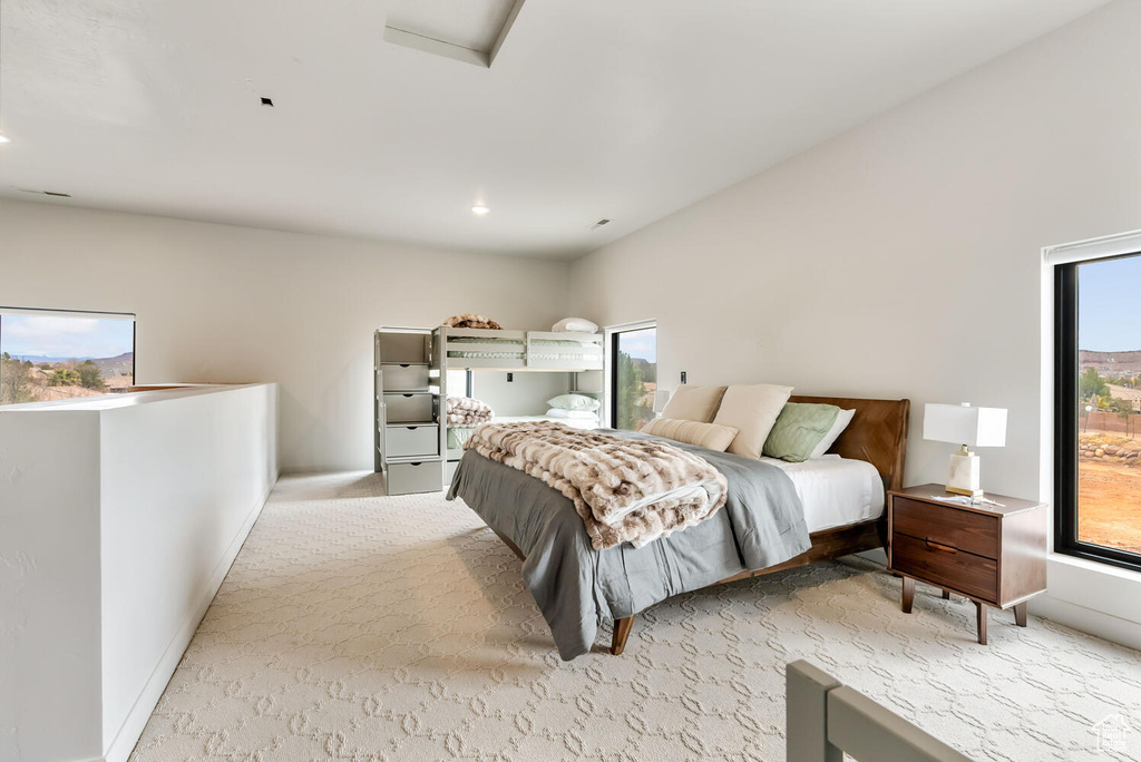 Bedroom featuring light colored carpet, baseboards, and recessed lighting