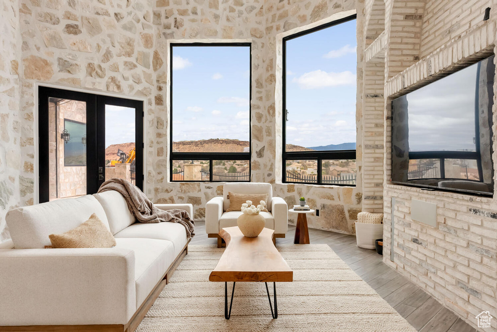 Living room with wood finished floors and plenty of natural light