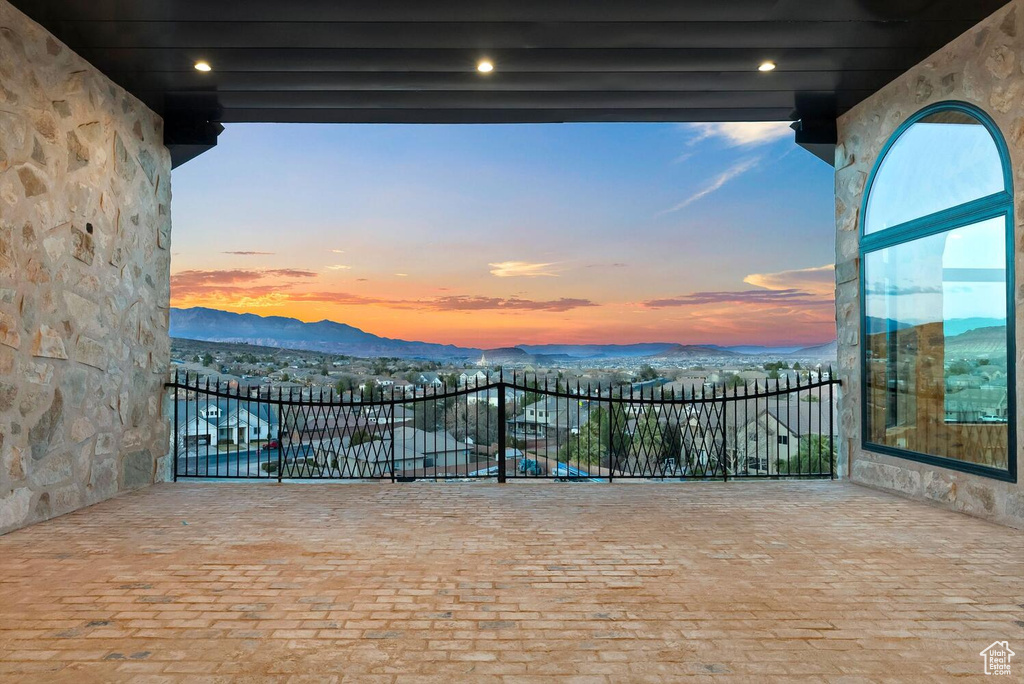 Patio terrace at dusk with a mountain view