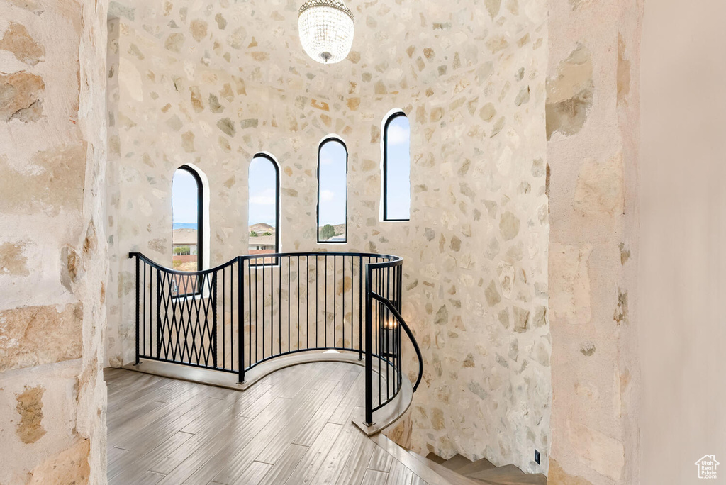 Stairs featuring wood finished floors