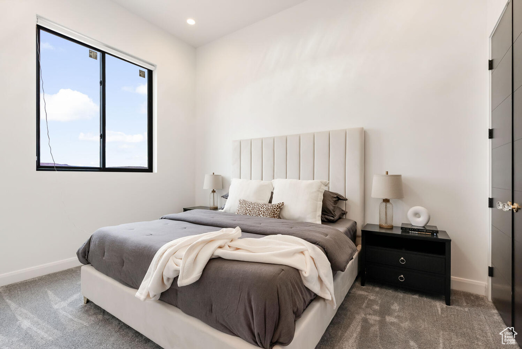 Carpeted bedroom featuring baseboards and recessed lighting