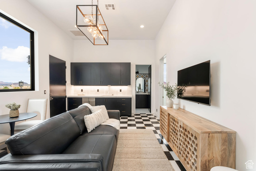 Living area featuring a chandelier and light flooring