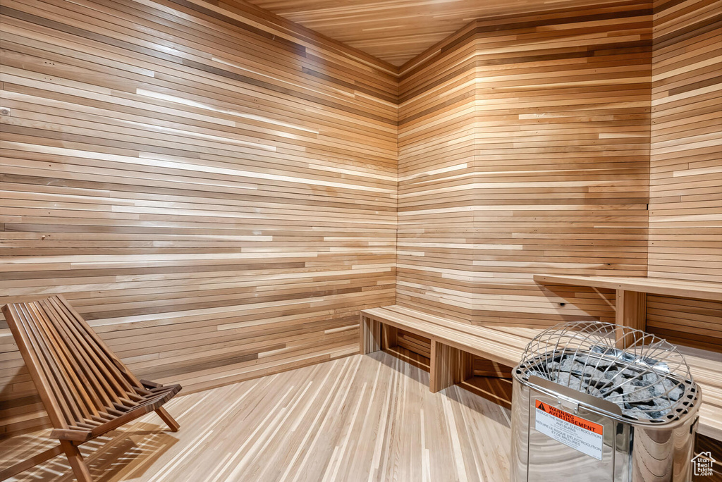 Relaxing sauna featuring wooden walls