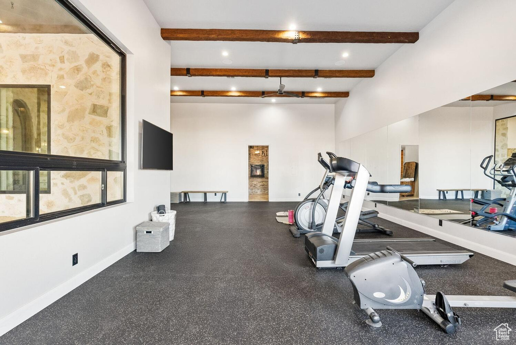 Exercise area with baseboards and recessed lighting