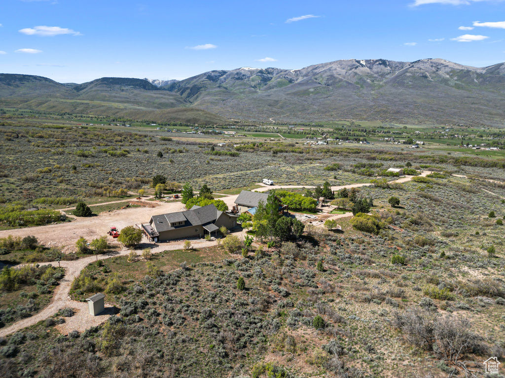 View of mountain backdrop featuring rural landscape