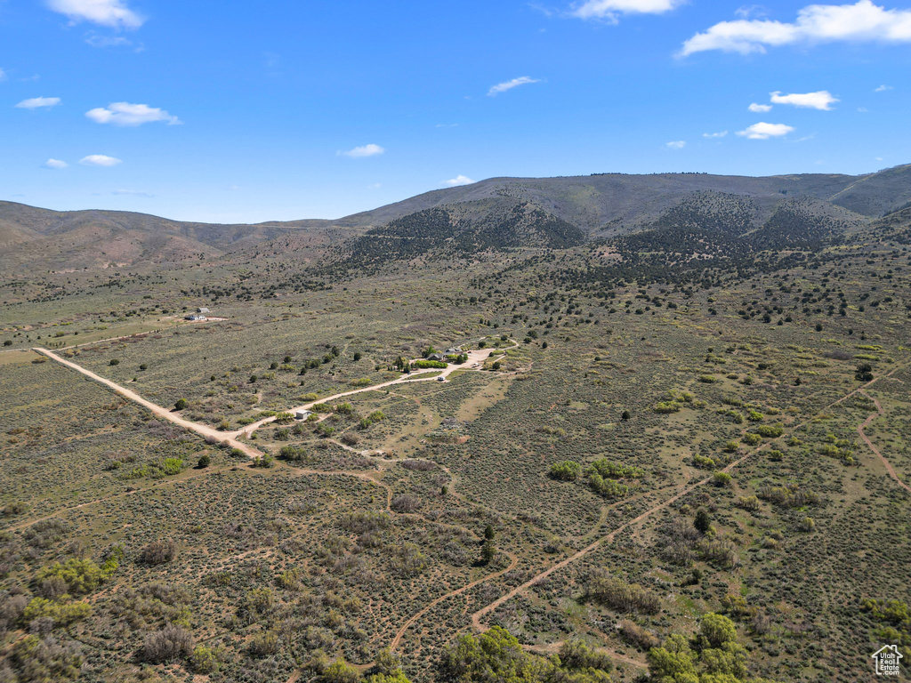 View of mountain backdrop with rural landscape