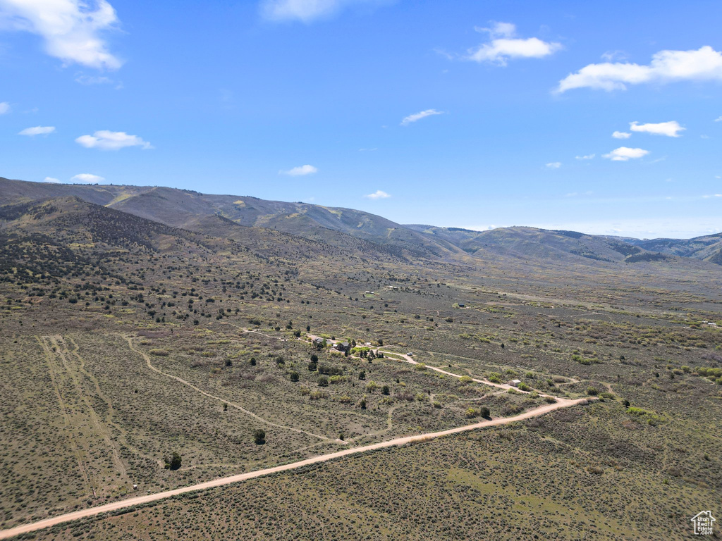 View of mountain backdrop with rural landscape