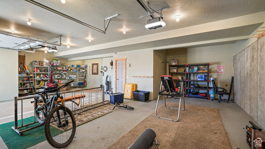 Garage featuring a garage door opener