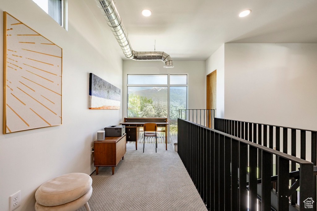 Hallway featuring carpet floors and recessed lighting