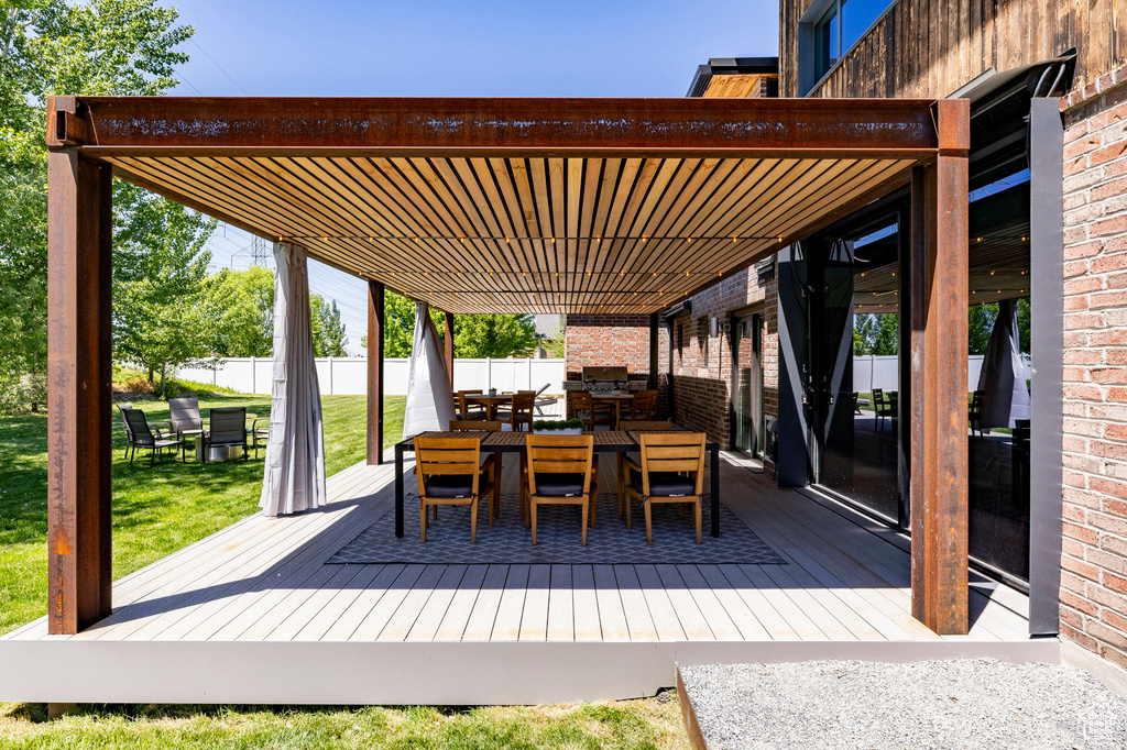 View of patio / terrace with outdoor dining space and a deck