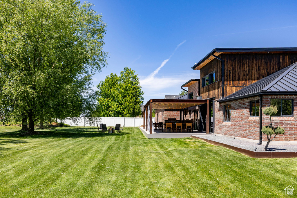 View of yard featuring a patio and a gazebo