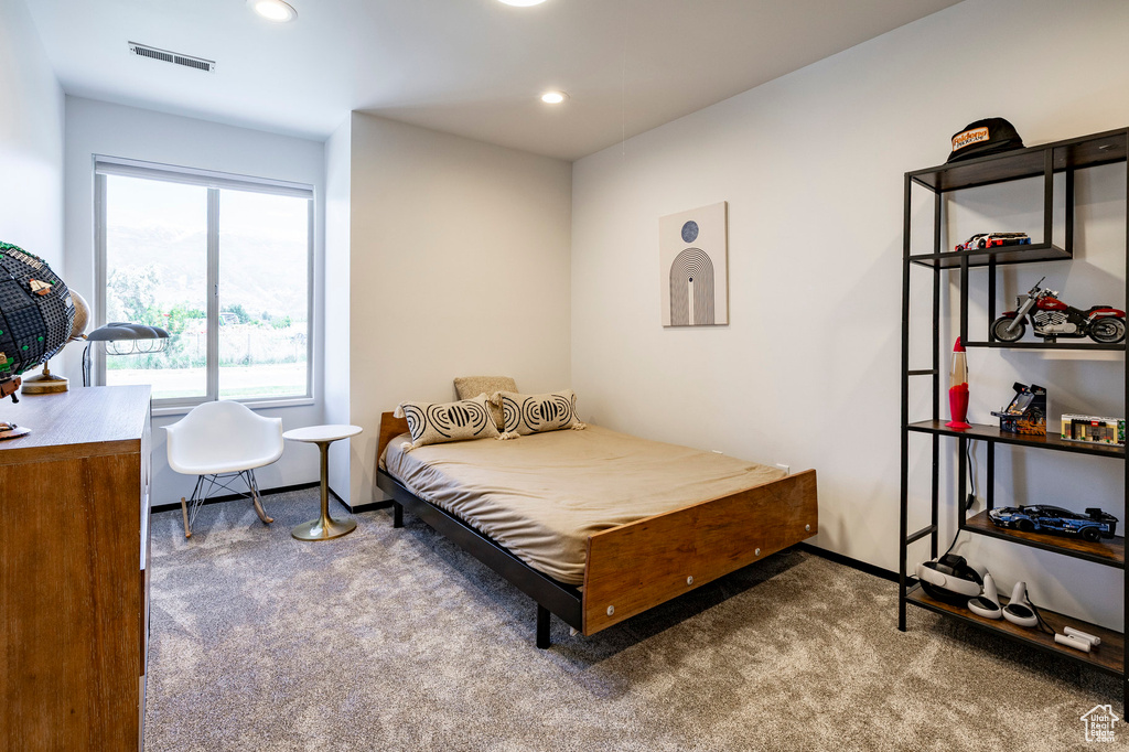 Bedroom with carpet flooring, baseboards, and recessed lighting