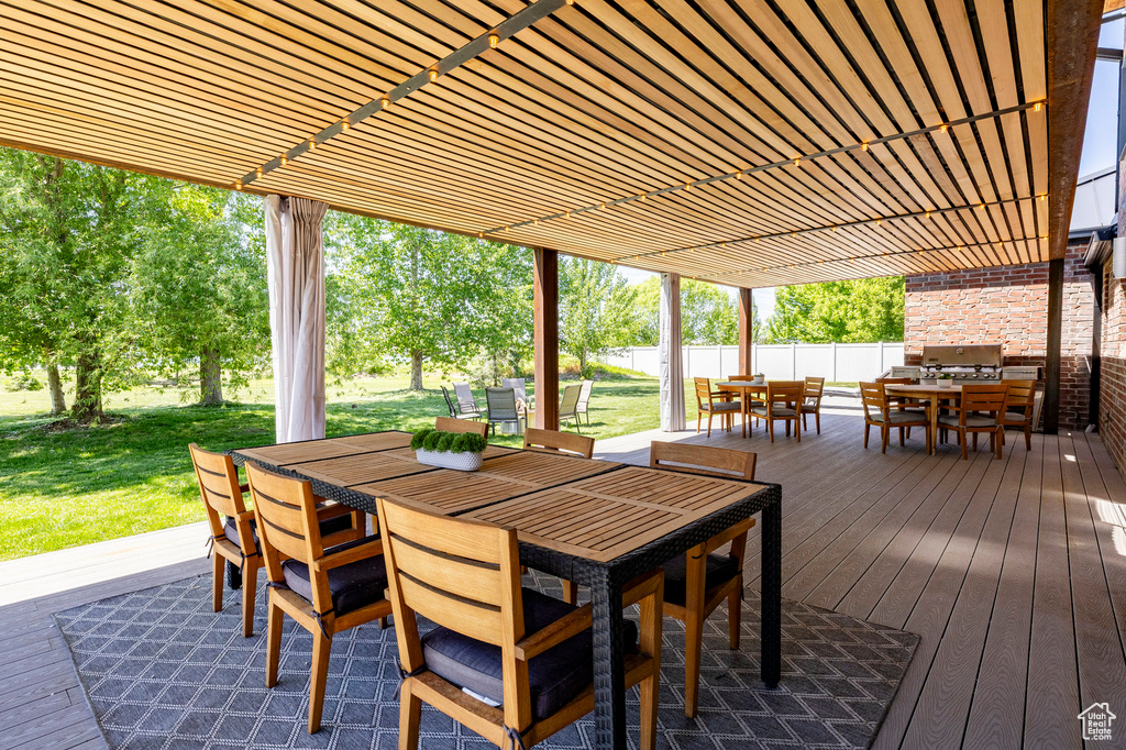 View of patio / terrace featuring outdoor dining area and a deck