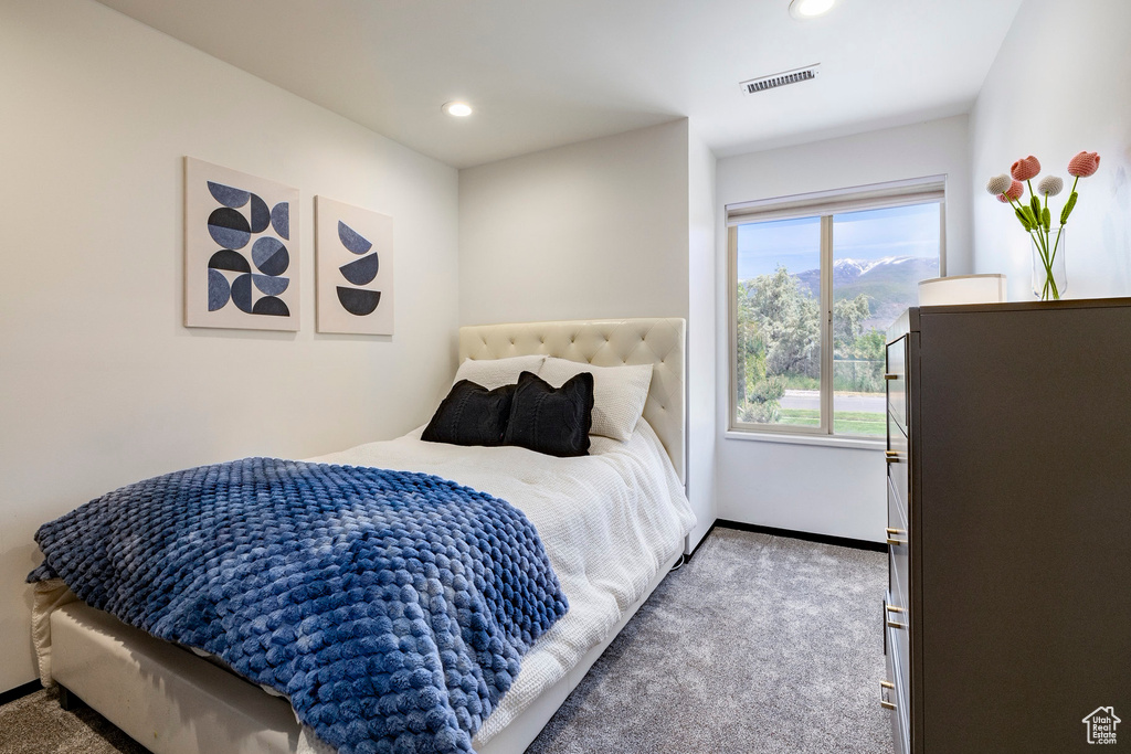 Carpeted bedroom featuring recessed lighting and baseboards