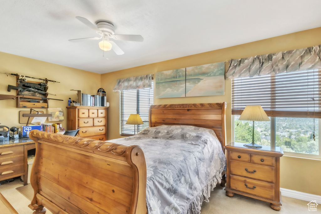 Bedroom with baseboards and ceiling fan