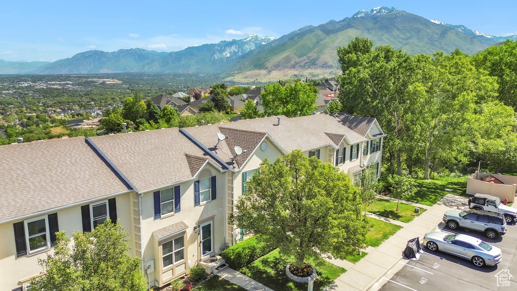 View of mountain backdrop featuring nearby suburban area
