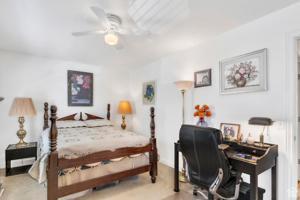 Bedroom featuring carpet flooring, baseboards, a desk, and a ceiling fan