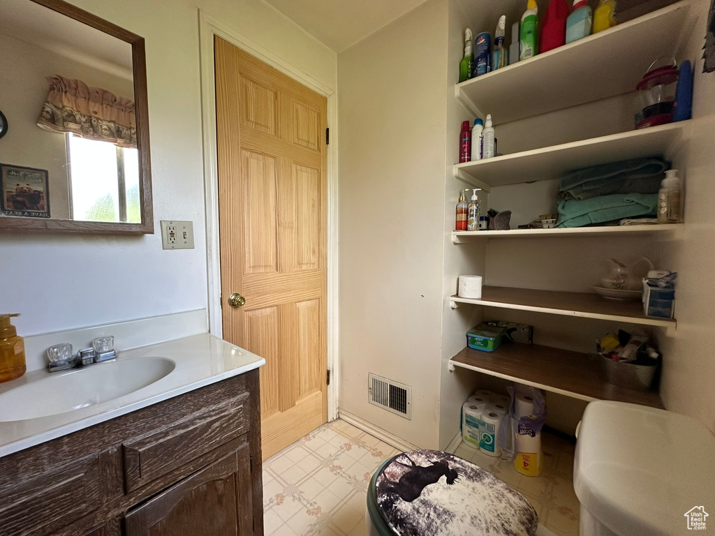 Bathroom with vanity and tile patterned floors