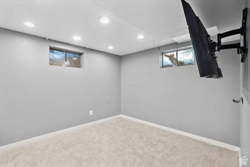 Basement featuring carpet floors, recessed lighting, and baseboards