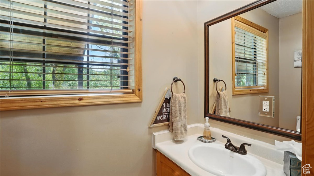 Half bathroom featuring vanity