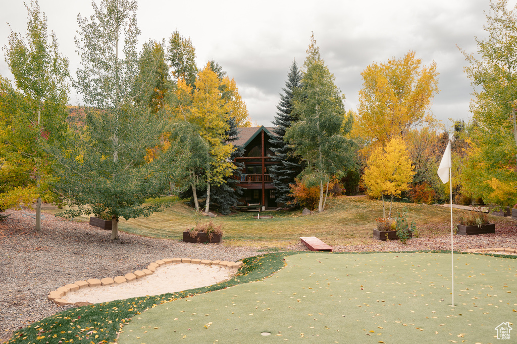 View of yard with an area to practice putting