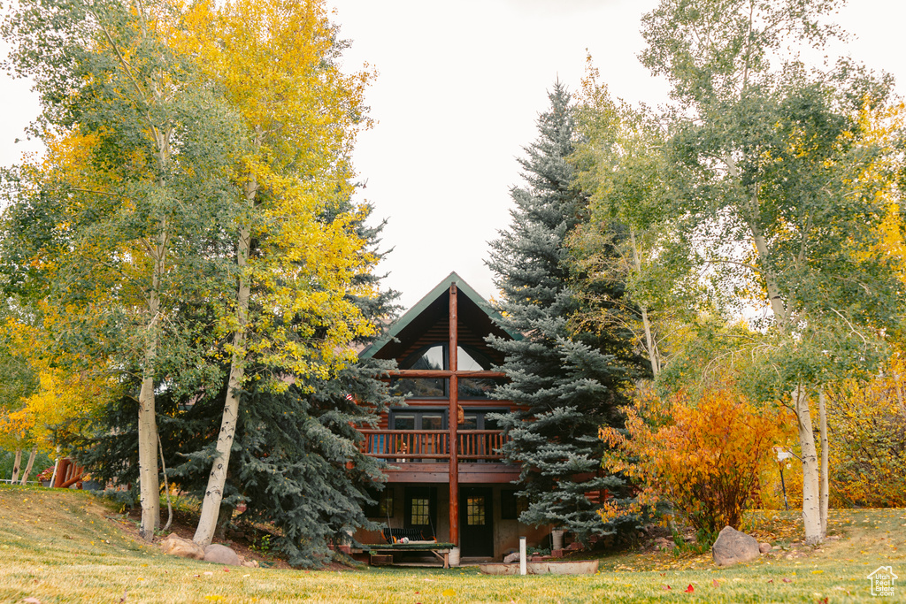 Rear view of house with a wooden deck