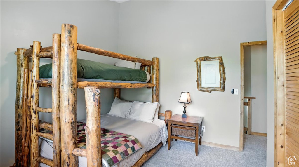 Carpeted bedroom with baseboards
