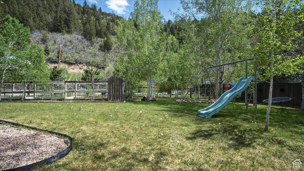 View of yard featuring a trampoline