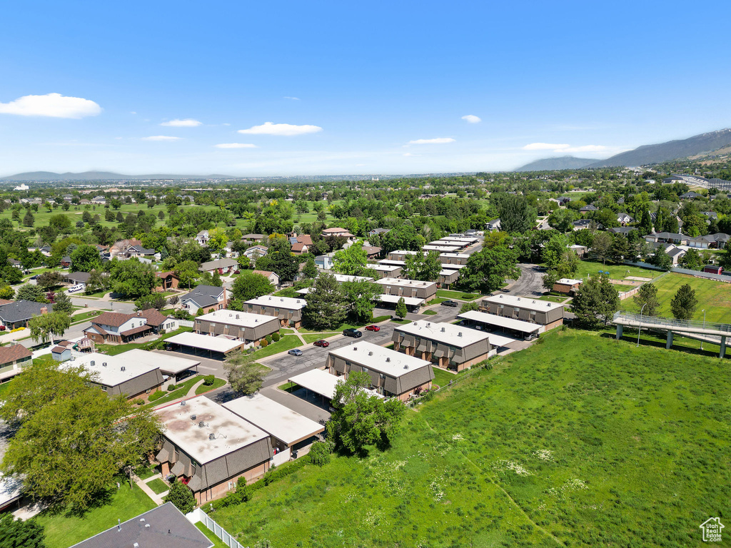 Aerial view of residential area featuring a mountain backdrop