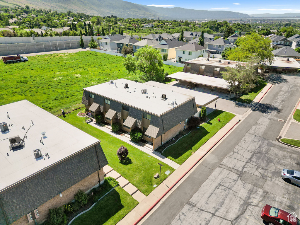 Aerial perspective of suburban area with a mountain backdrop
