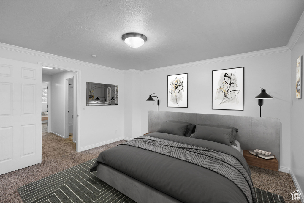 Carpeted bedroom featuring baseboards and ornamental molding