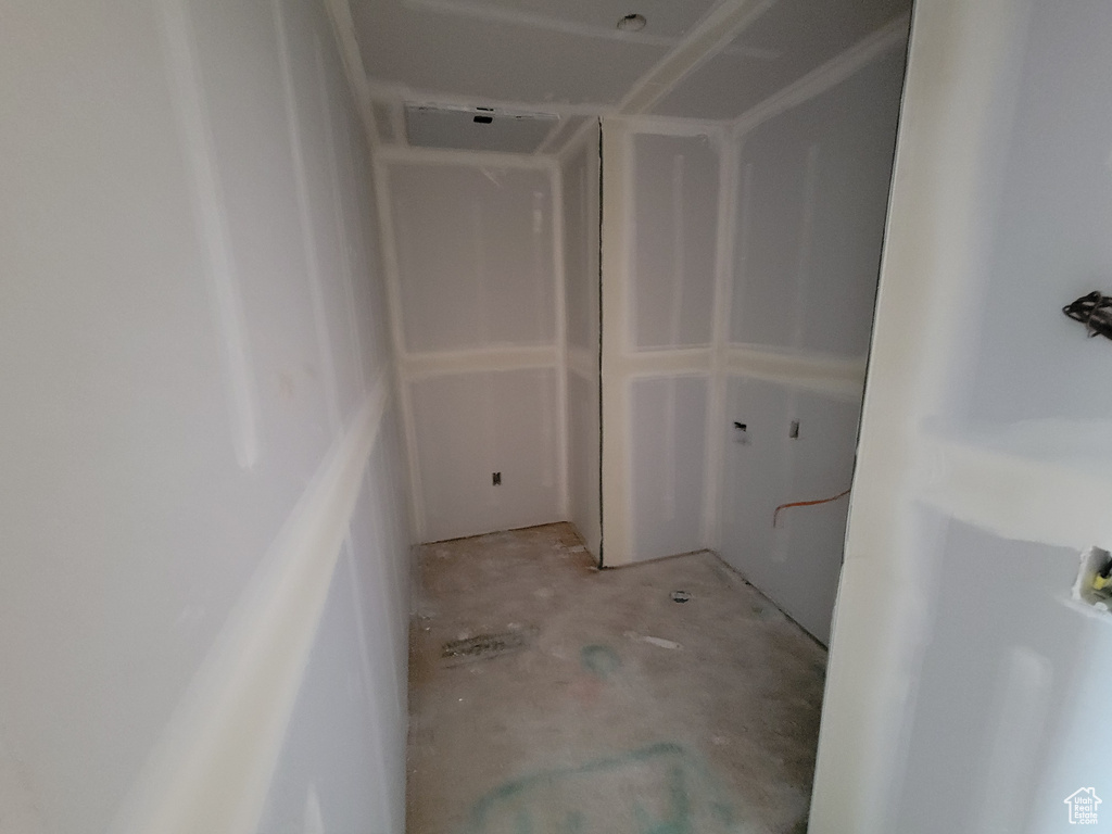 Bathroom with unfinished concrete flooring