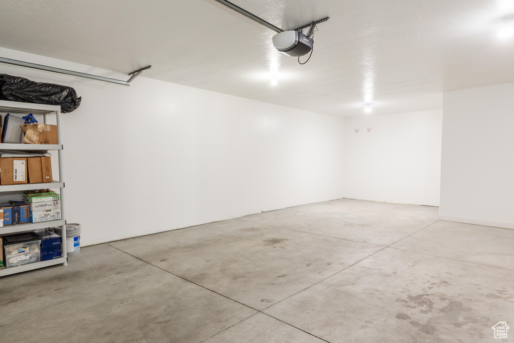 Garage featuring a garage door opener