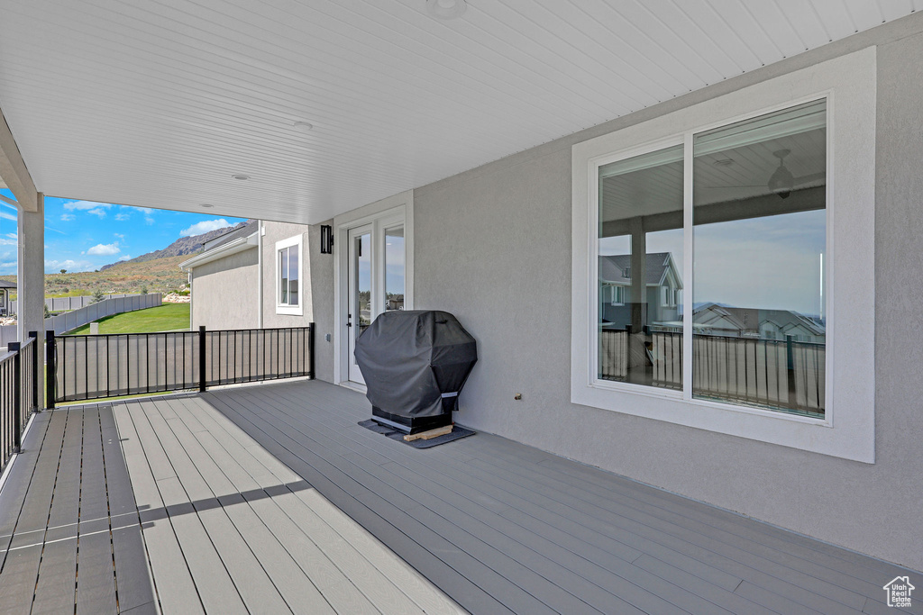 Wooden terrace with a grill